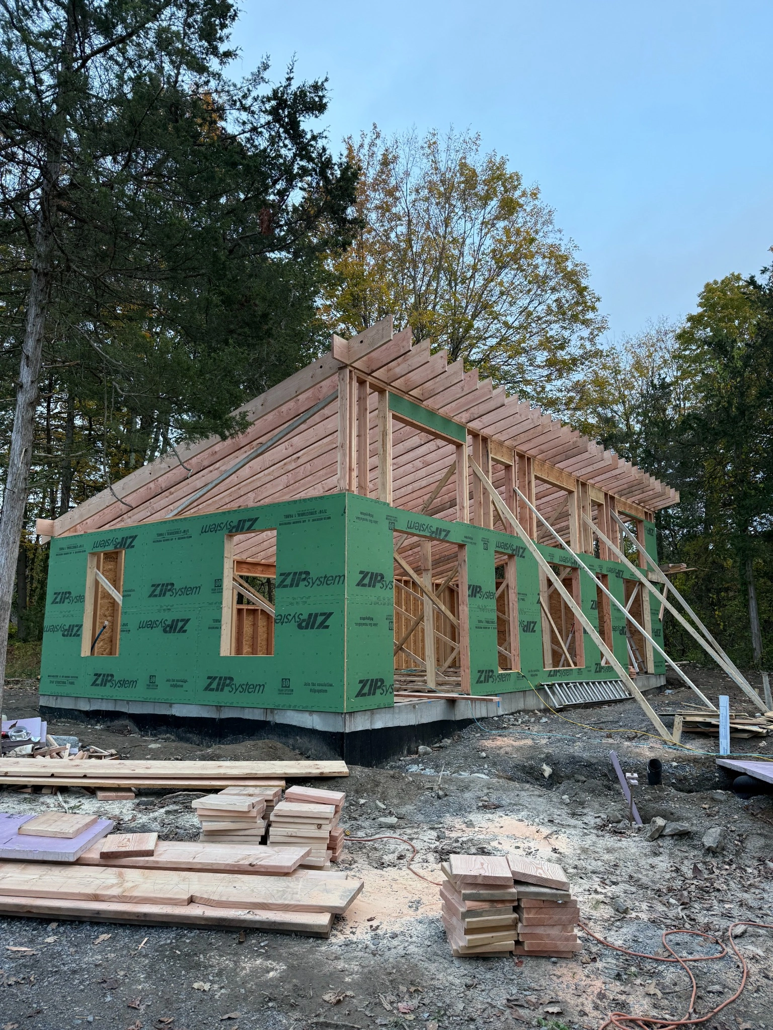 Wood framing with ZIP System sheathing installed on concrete foundation