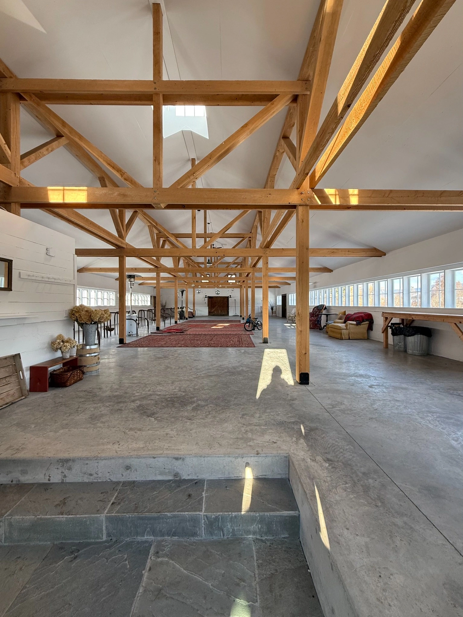 Excavator and compactor preparing gravel base for construction